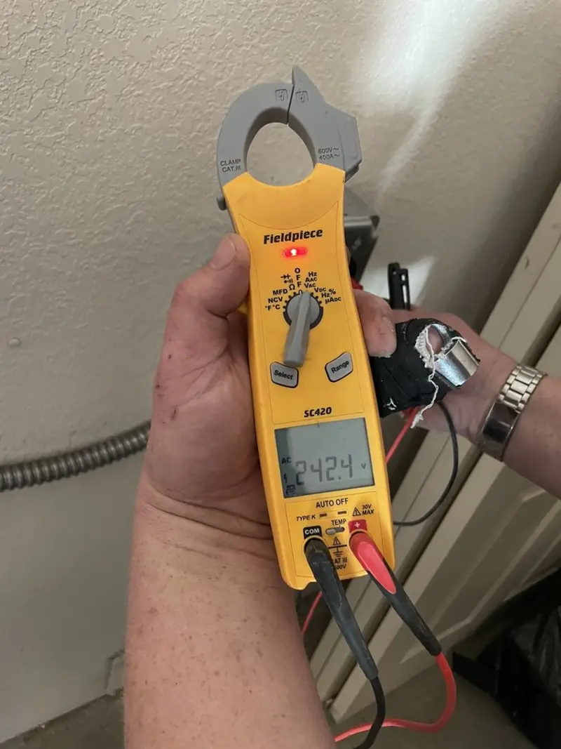 Voltage testing with clamp meter during Electrical Installation Services in Matthews